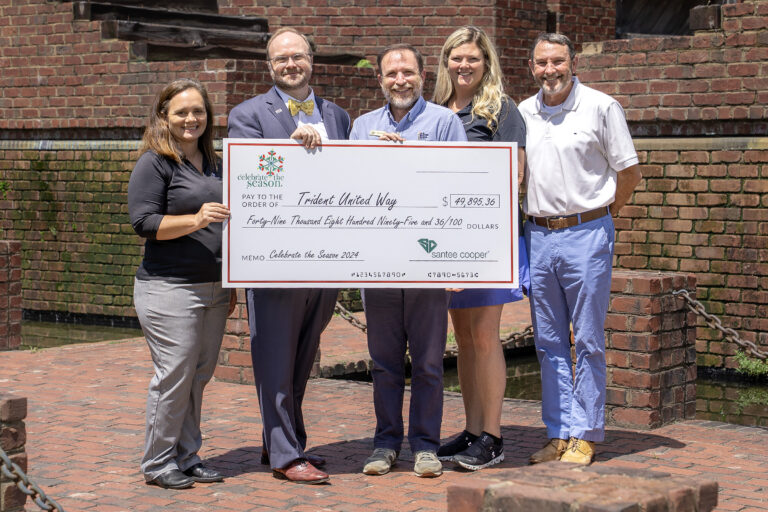 Trident United Way receives a $49,895 check from Celebrate The Season proceeds.