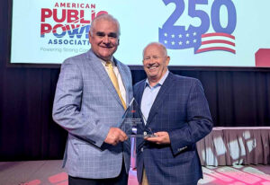 Neil James accepts award